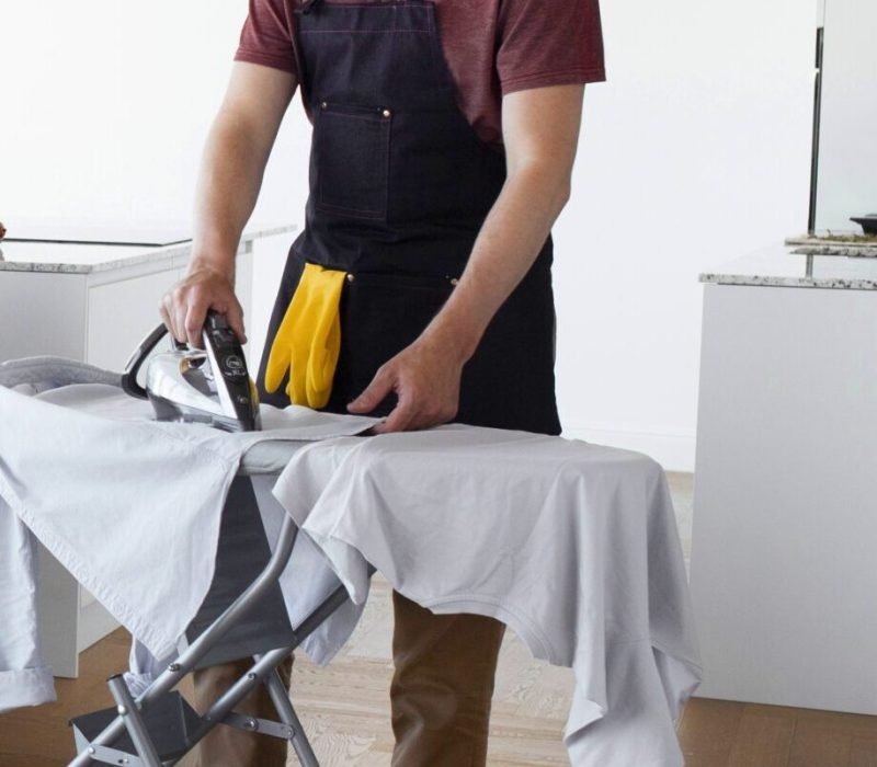 man-servant-ironing-clothing